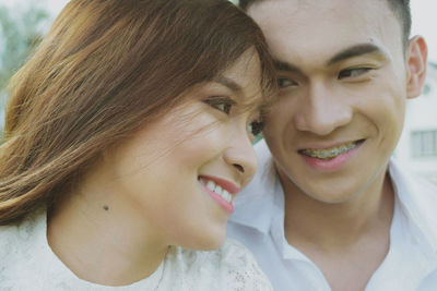 Close-up portrait of happy mother with baby