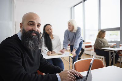 Portrait of smiling man in class