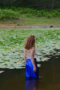 Woman standing in lake