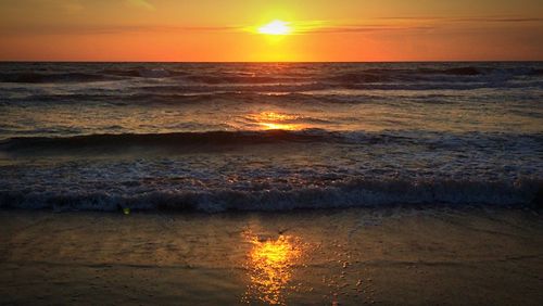 Scenic view of sea at sunset