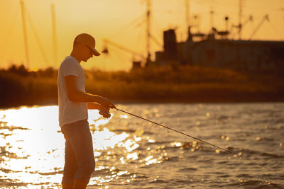 Full length of man standing in sea