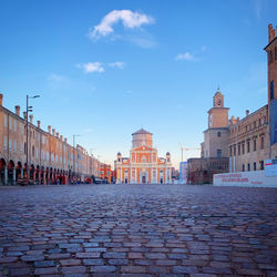View of buildings in town against sky