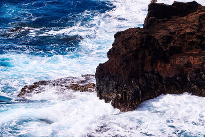 Scenic view of rocks on beach