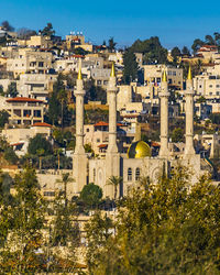 High angle view of townscape against blue sky