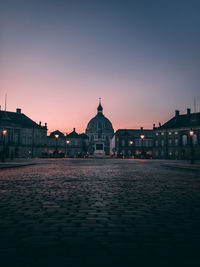 View of buildings against sky at dusk