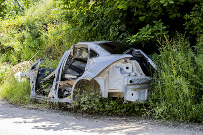 Abandoned car on field