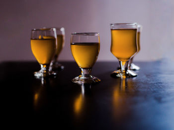 Close-up of beer glass on table