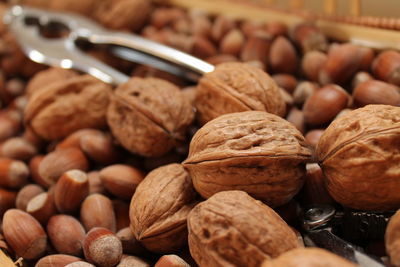 Close-up of a pile of nuts and hazelnuts in a basket in the kitchen. 