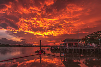 Scenic view of river against sky during sunset