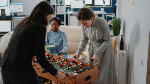 Rear view of business colleagues working at office