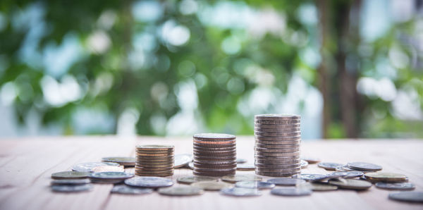 Close-up of stacked coins on table