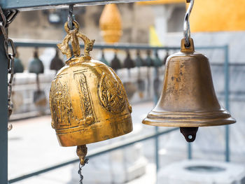 Close-up of metal chain hanging in temple