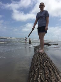 Woman standing on beach