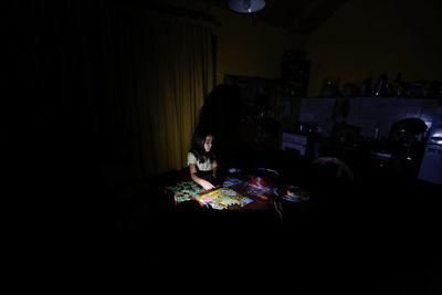 People sitting in the dark room
