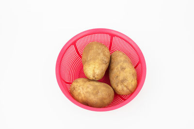 High angle view of eggs in bowl against white background