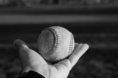 Close-up of hand holding ball