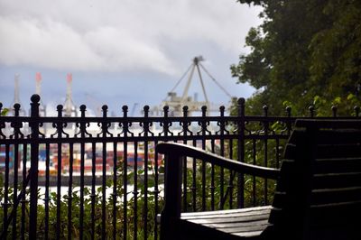 Bridge over river against cloudy sky