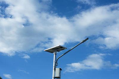 Low angle view of street light against sky