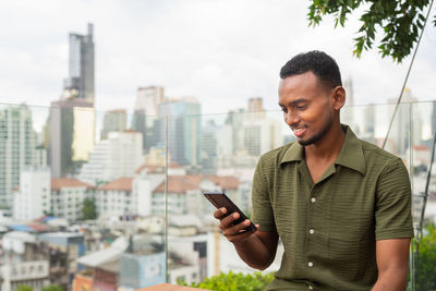 Young man using mobile phone