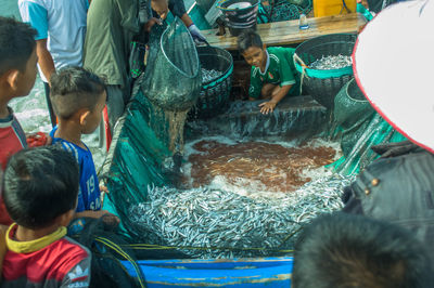 High angle view of people at fish market