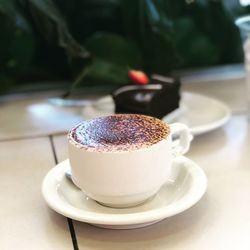 Close-up of coffee cup on table