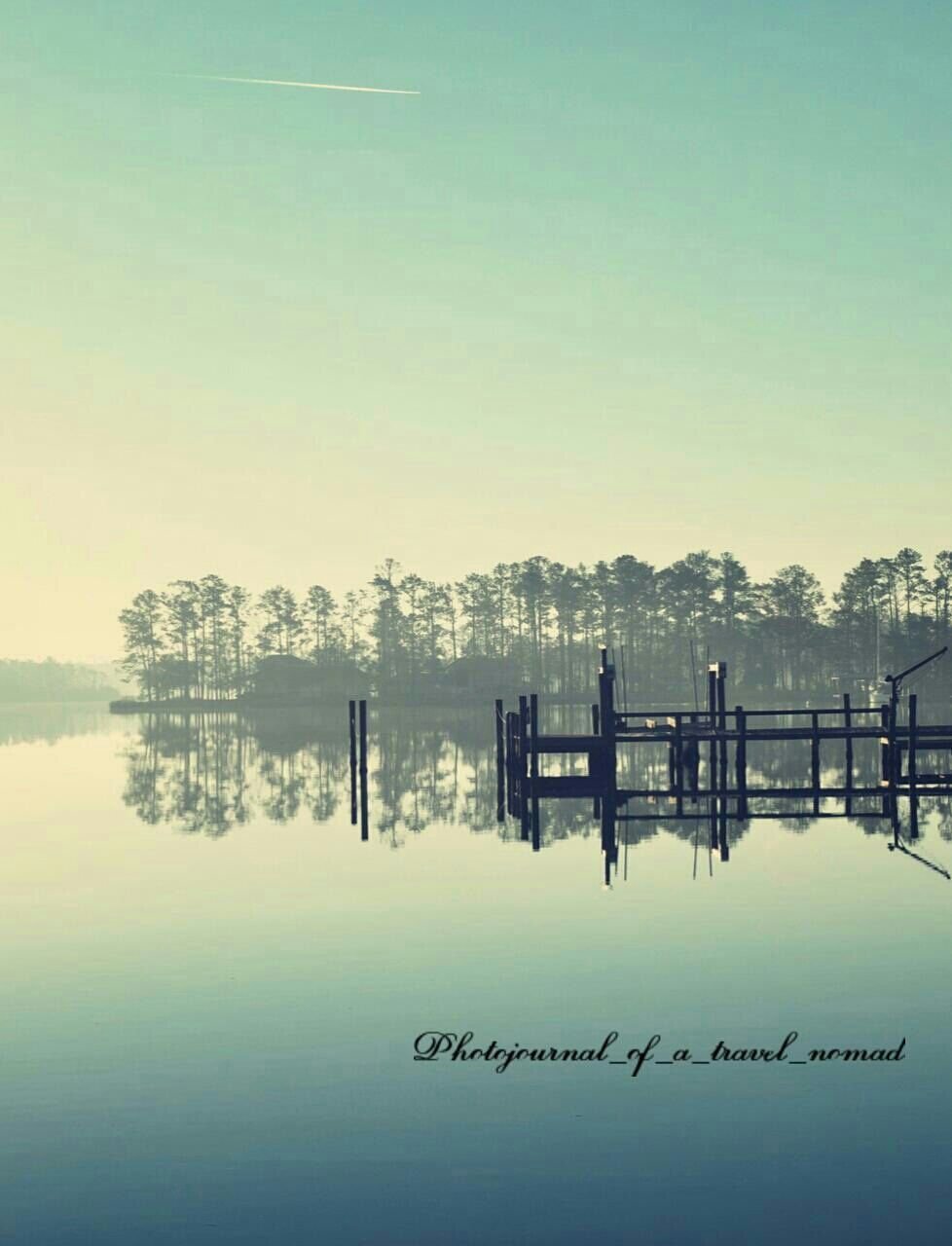 SCENIC VIEW OF CALM LAKE AGAINST CLEAR SKY