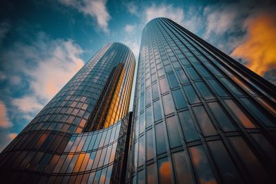 Low angle view of modern skyscraper against sky