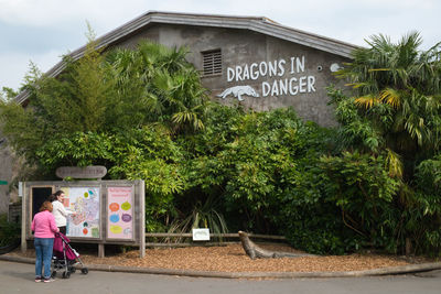 View of information sign against trees