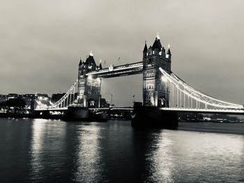 View of bridge over river against cloudy sky