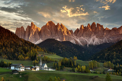 Panoramic view of lake and mountains against sky during sunset