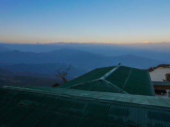 Scenic view of landscape against blue sky