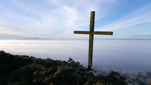 Cross against sky