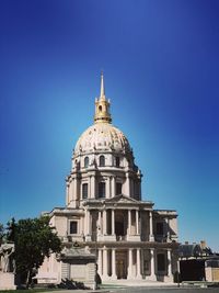 Low angle view of building against blue sky