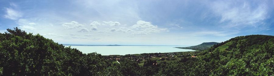 Scenic view of sea against cloudy sky