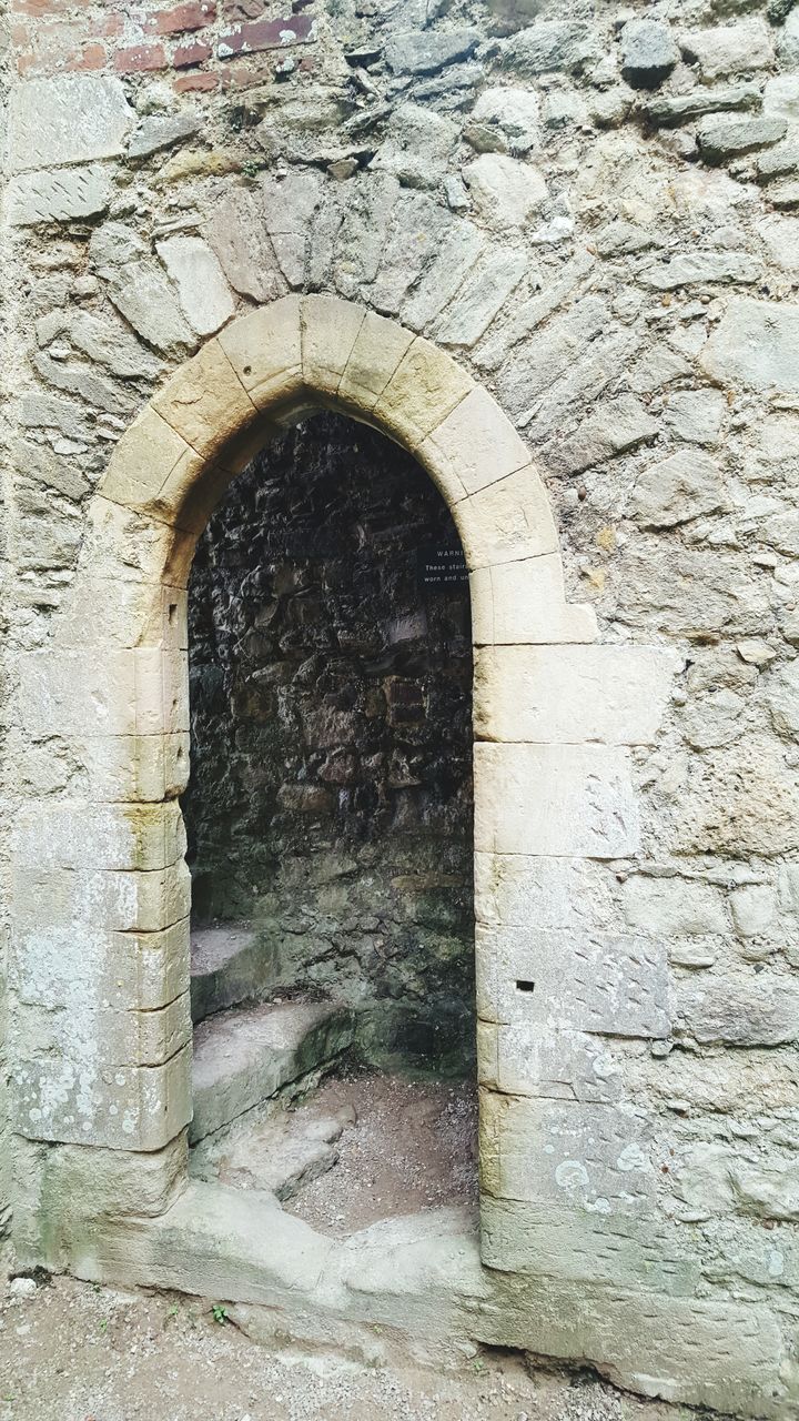 arch, architecture, built structure, wall - building feature, brick wall, stone wall, building exterior, circle, tunnel, old, day, weathered, hole, archway, wall, street, outdoors, textured, no people, cobblestone