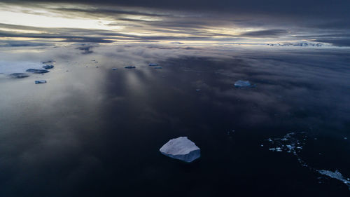 Aerial view of frozen sea against sky