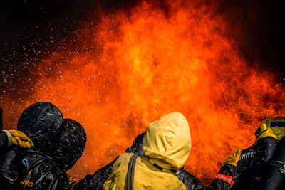 Firefighter against orange fire