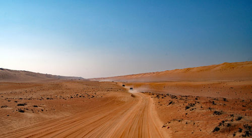 Scenic view of desert against clear sky