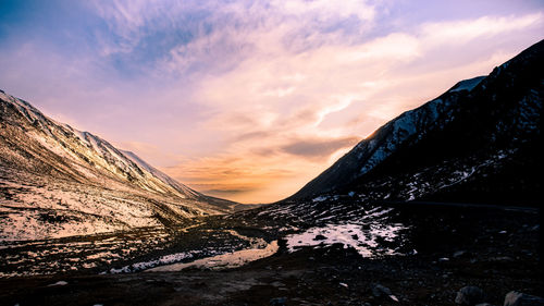 Scenic view of mountains against sky during sunset