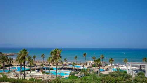 Panoramic view of beach against blue sky