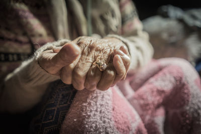 Midsection of woman in warm clothing outdoors
