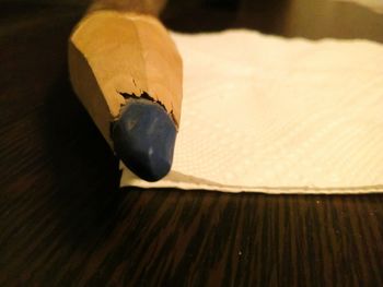 High angle view of paper on wooden table