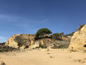 Rock formations in desert against sky