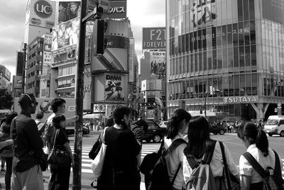 People walking on street in city