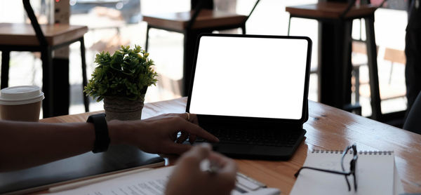 Man using laptop on table