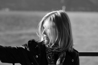 Portrait of woman against water