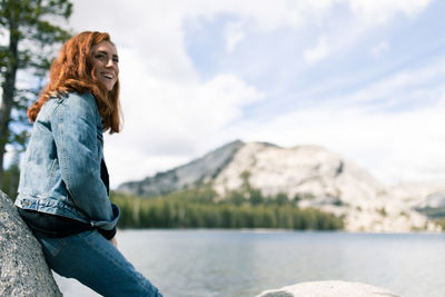 Side view of young woman in lake