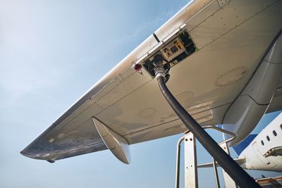 Ground service before flight. refueling of airplane at airport.