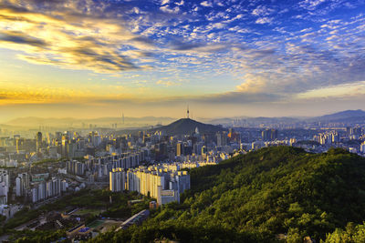 High angle view of buildings against sky at sunset