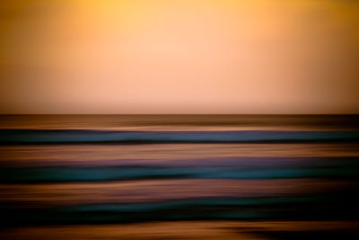 Scenic view of beach against sky during sunset